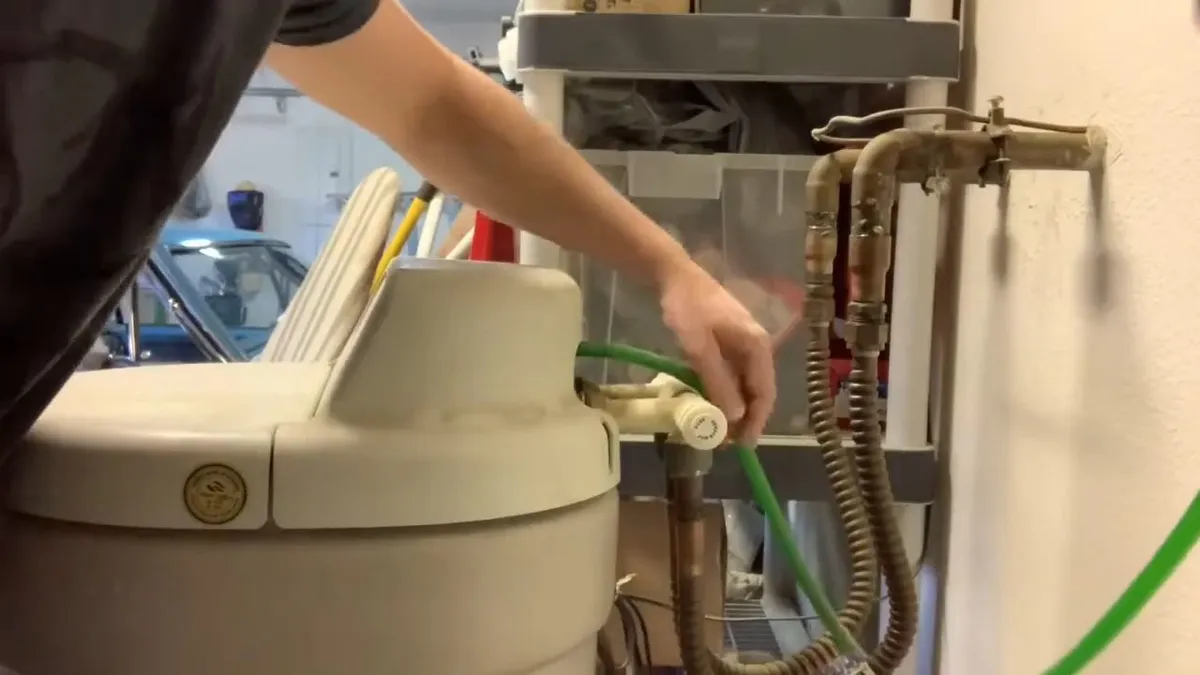 Whole-house water softener with control valve and resin tank during plumbing service in El Mirage, with focus on temple city whole water softener