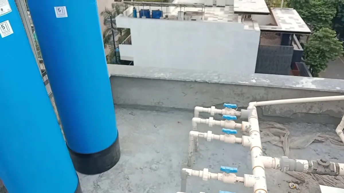 Whole-house water softener with control valve and resin tank during plumbing service in Rancho Gabriela, Surprise, AZ