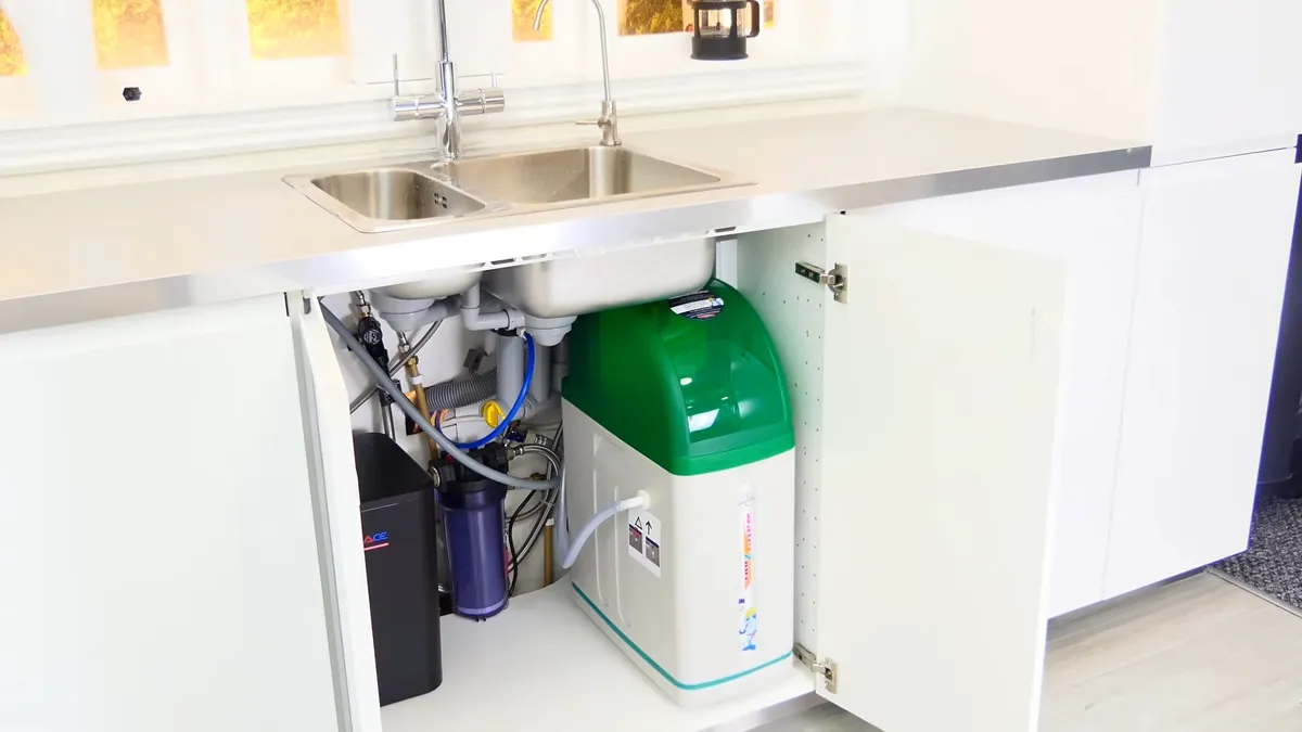 Under-sink reverse osmosis filter system connected below a cabinet illustrating reverse osmosis for surprise az drinking water, with focus on sink reverse osmosis filter system