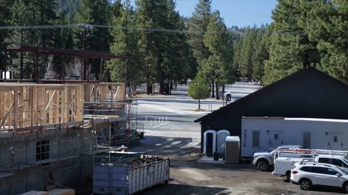 Exterior building view with trees and driveway access during plumbing service in White Tank Mountain Regional Park